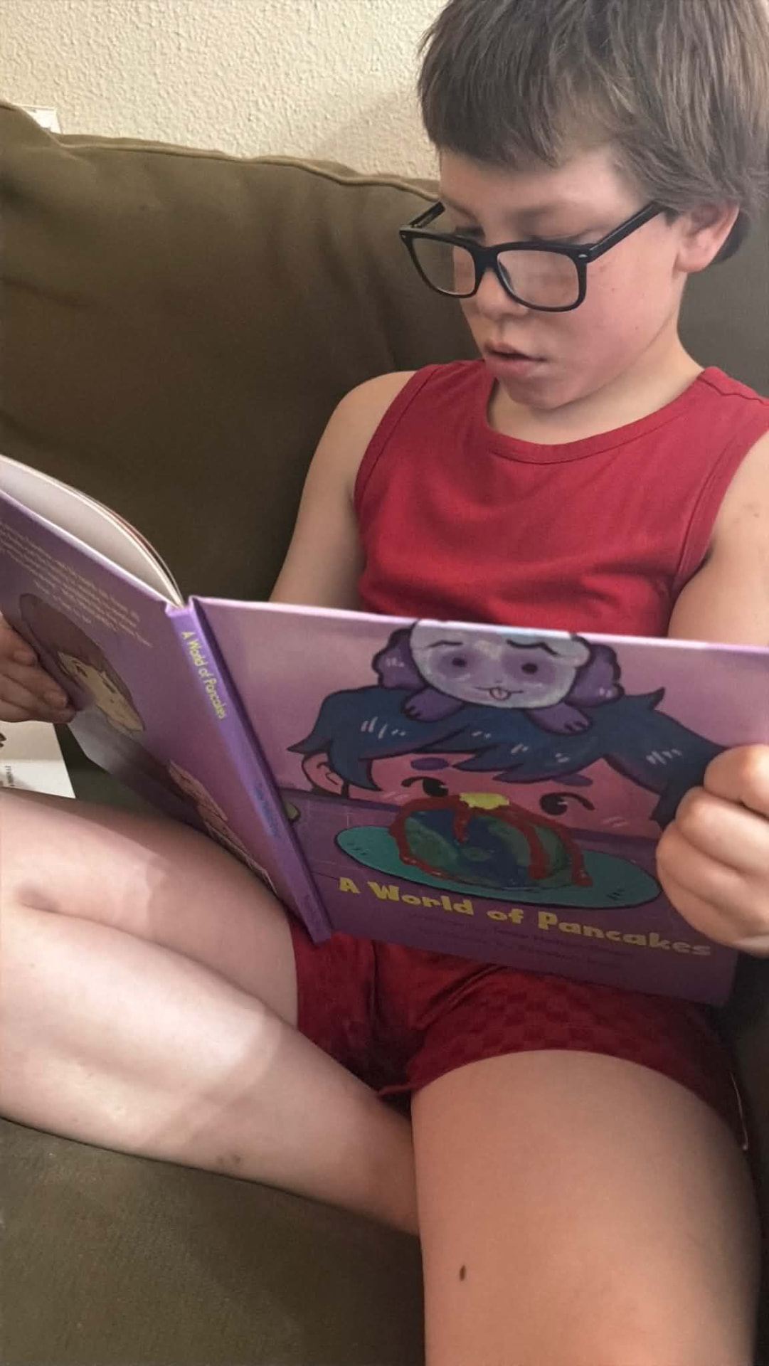 Child reading A World of Pancakes